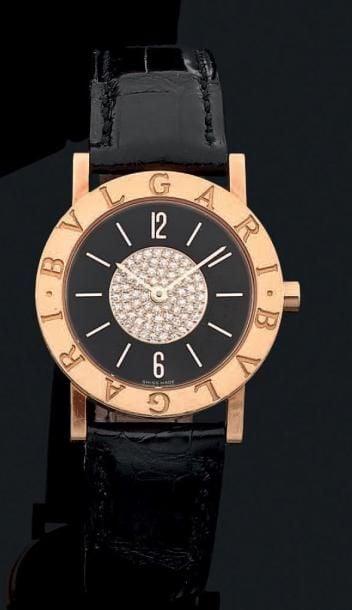BRACELET MONTRE ronde, modèle «Bulgari», en or jaune (750 millièmes
