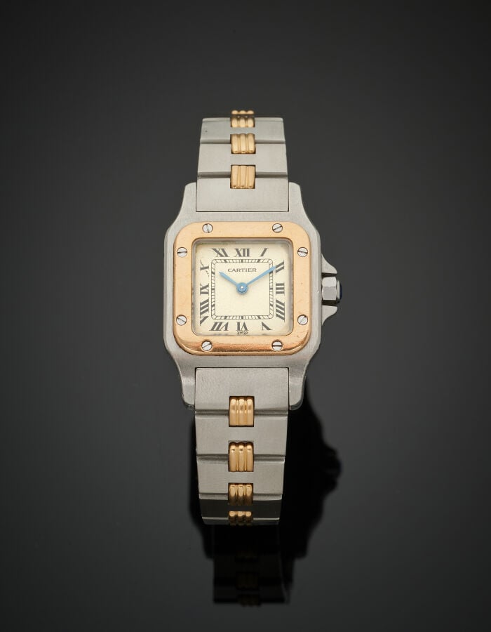 CARTIER - BRACELET MONTRE carrée, modèle "Santos" en or jaune (750‰) et acier.…