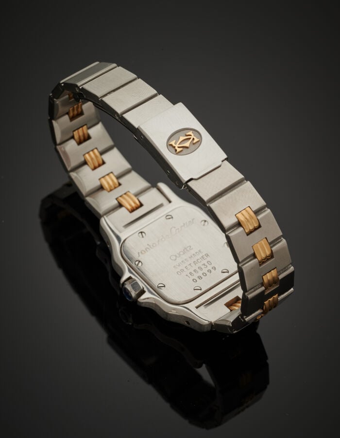 CARTIER - BRACELET MONTRE carrée, modèle "Santos" en or jaune (750‰) et acier.…