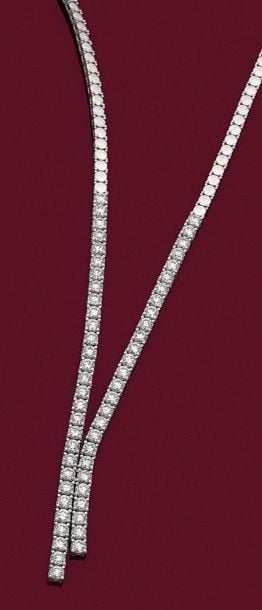 COLLIER en or gris (750 millièmes) partiellement boulé et serti de deux lignes asymétriques comprenant 56 diamants taille brillan