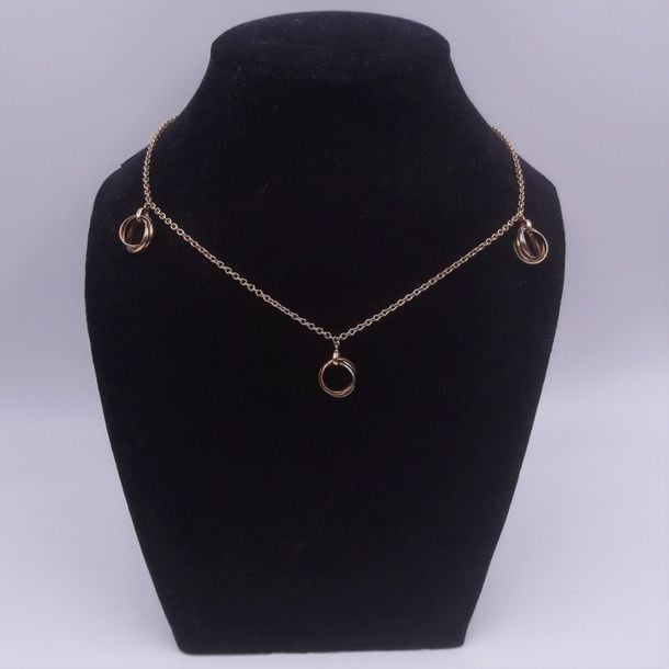 COLLIER «Trinity» composé d'une chaînette retenant trois pendentifs «trois anneaux», trois ors (750 millièmes