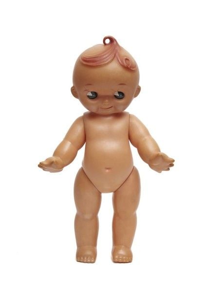 Figurine rose figurant un chérubin dénudé avec de gros yeu