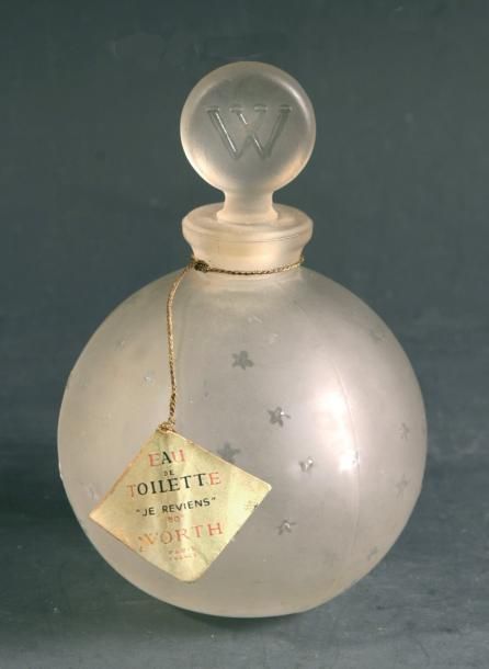 Flacon boule Worth en verre satiné moulé à semis d'étoiles; bouchon monogramm