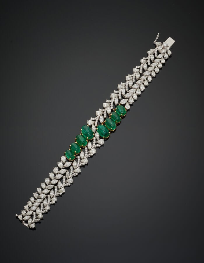 Important BRACELET « feuillages » en or gris (750‰) ajouré, serti de diamants t…