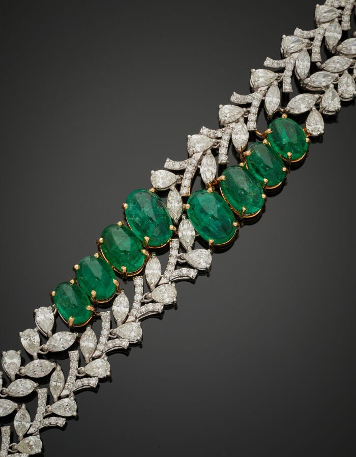 Important BRACELET « feuillages » en or gris (750‰) ajouré, serti de diamants t…