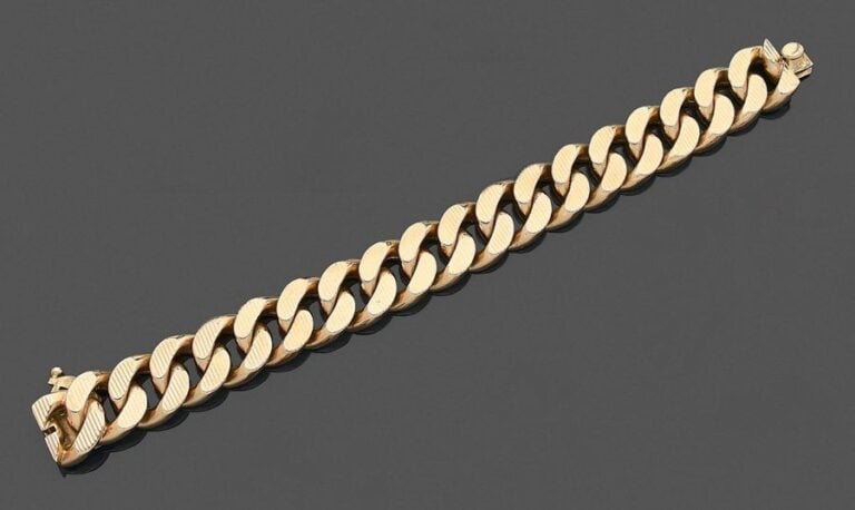 •Important BRACELET gourmette en or jaune (750‰) guilloch