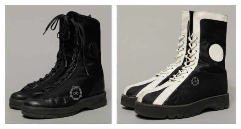 LOT comprenant DEUX PAIRES de CHAUSSURES à lacets montantes signées au dos en nylon et cuir, la première noire (P7) (mini patine d'usage), la seconde noire et blanche (P7) (mini patine d'usage)