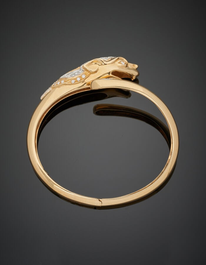 Mario FONTANA - BRACELET "panthère" rigide ouvrant en or jaune (750‰). La tête…