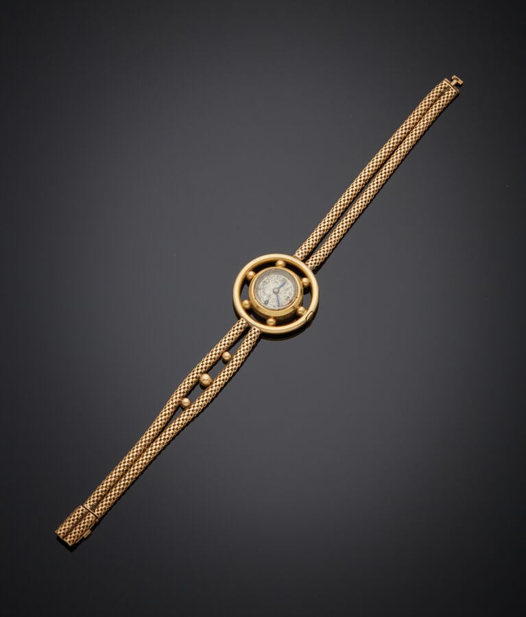 MELIK - BRACELET MONTRE "gouvernail" de dame en or jaune (750‰). Cadran crème (…