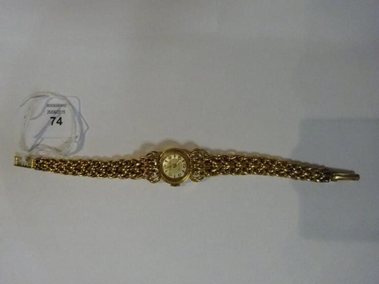 Montre bracelet en or jaune 18k (750°/00) à boitier ron