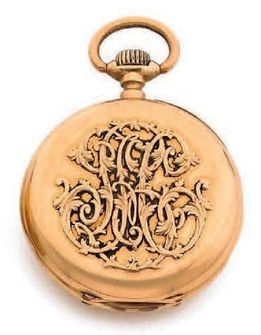 MONTRE DE POCHE en or jaune (750 millièmes) appliqué d'un monogramm