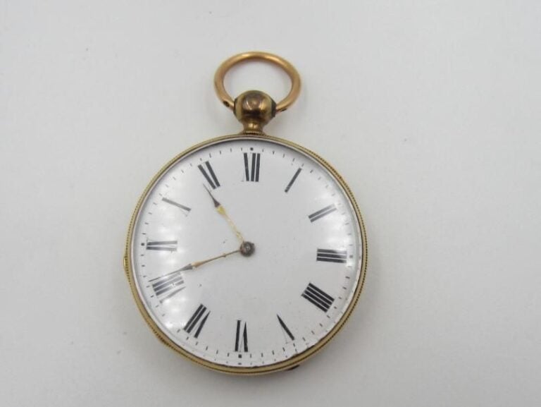 MONTRE DE POCHE en or jaune (750 millièmes) finement ciselé d'une rosace stylisé