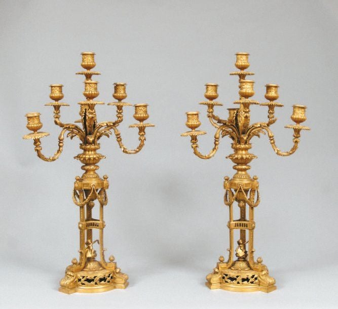 Paire de candélabres en bronze ciselé et doré, à sept lumières sur deux étage