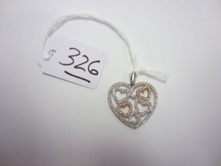 PENDENTIF «coeurs» en or gris et or rose (750 millièmes) ajouré serti de diamants taille brillan