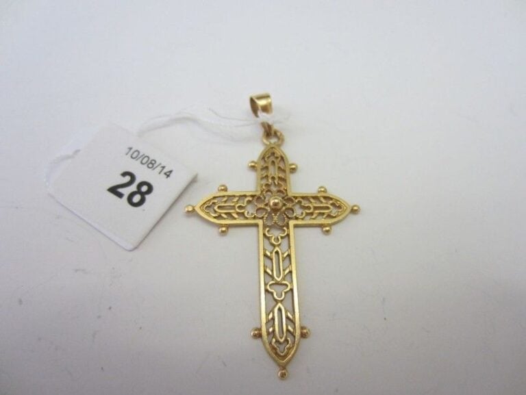 PENDENTIF «croix» en or jaune (750 millièmes) ajouré, et boul