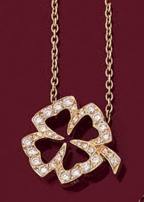 PENDENTIF «trèfle à quatre feuilles» en or jaune (750 millièmes), et sa chaînette, ajouré serti de diamants taille brillan