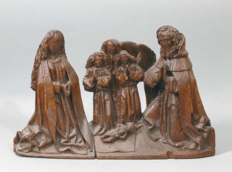 Petit groupe en chêne sculpté en applique représentant « La Nativité avec les Anges adorateurs