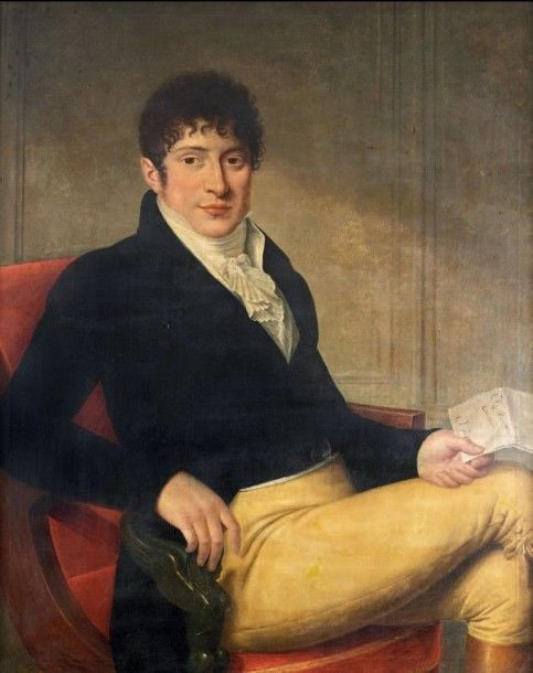 Portrait de jeune homme assis tenant une lettre