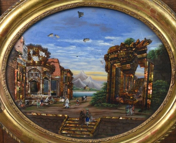 Ravissant fixé sous verre de section ovale à décor de personnages et d'architectures orientalistes ; peinture sur fond nacré signée et datée en bas: 1857 (accidents et manques