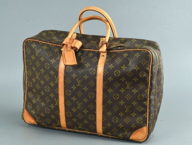 Sac / valise souple en toile monogram, modèle Sirius, fermeture zippée, cadenas (manque la clé