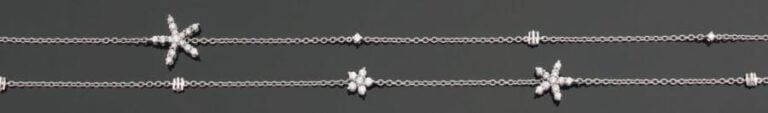 SAUTOIR « étoiles de mer » en or gris partiellement serti de diamant