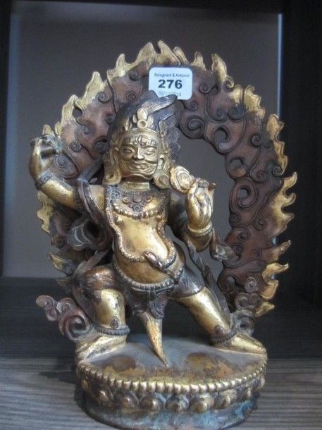 Sujet en bronze doré représentant Vajrapani debout sur un lotus, adossé à une mandorle Tibet, début XXe siècl