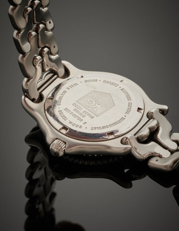 TAG HEUER - BRACELET MONTRE ronde en acier. Lunette graduée tournante bidirecti…