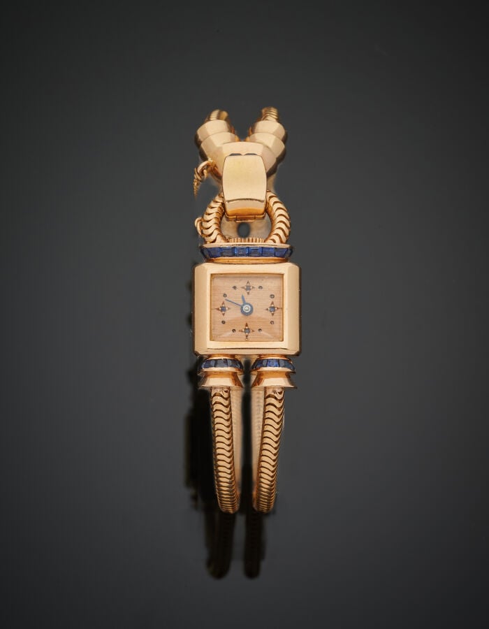 UTI - BRACELET MONTRE carrée de dame en or jaune (750‰), modèle "cadenas". Atta…
