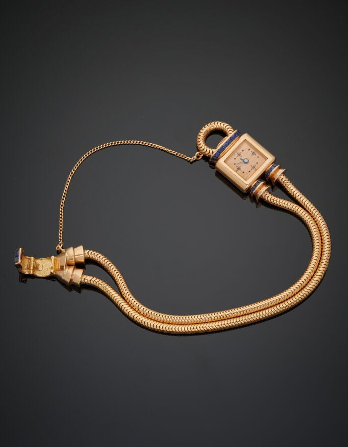 UTI - BRACELET MONTRE carrée de dame en or jaune (750‰), modèle "cadenas". Atta…