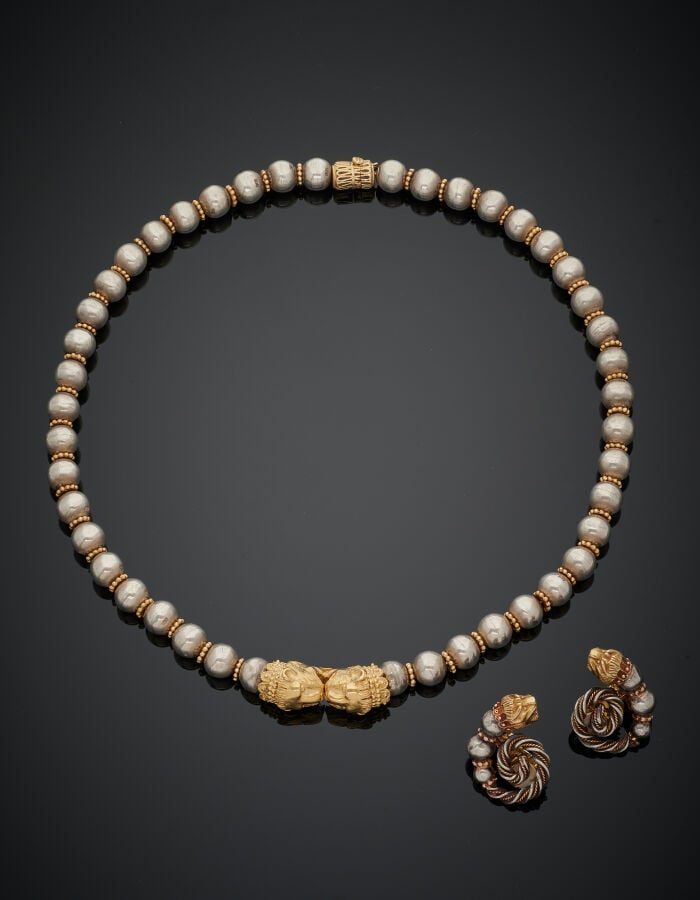ZOLOTAS - DEMI-PARURE "têtes de lions" en or jaune (750‰) et argent (min. 800‰)…