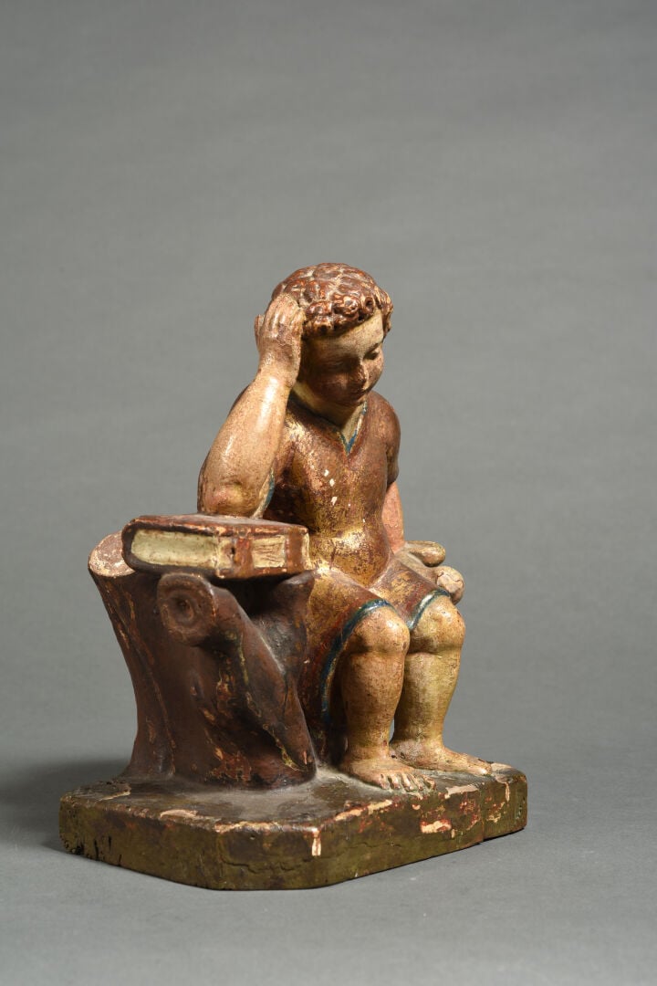 Enfant Jésus méditant en bois sculpté en ronde-bosse, polychromé et doré. Assis…