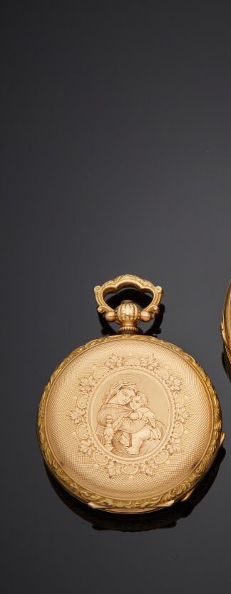 Une MONTRE de POCHE en or jaune (750%) ciselé et guilloché, figurant « une mate…