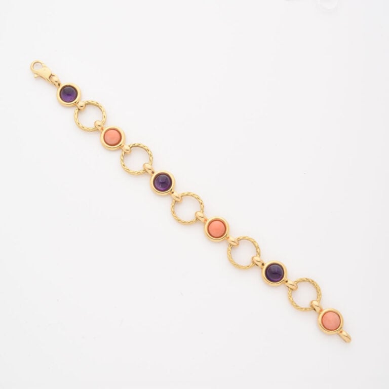 Bracelet articulé en or jaune (750) formé de maillons ajourés torsadés alternés…