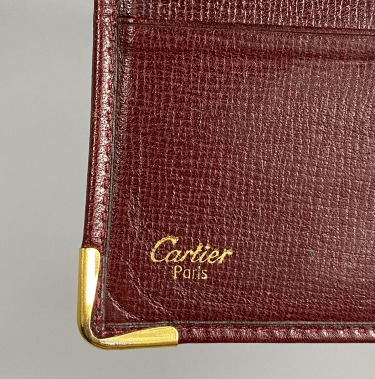 CARTIER - Portes-cartes huit compartiments en cuir bordeaux - 11 x 10 cm - État…