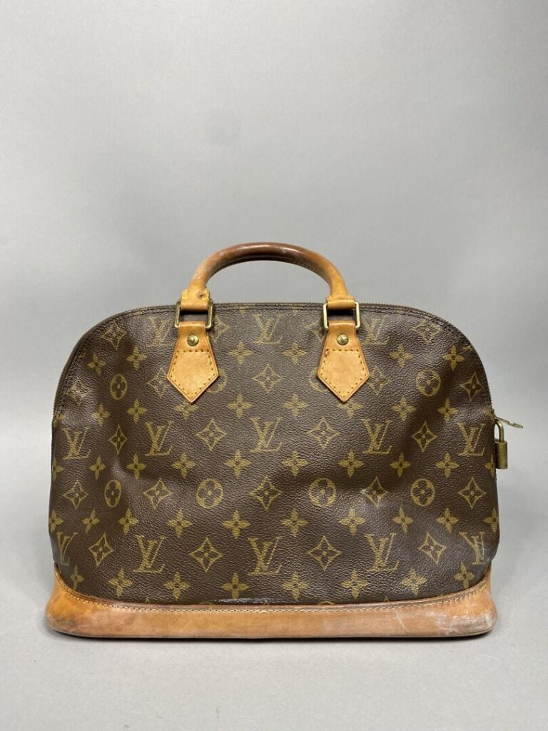 LOUIS VUITTON - Année 1994. - Sac « Alma » en toile monogram et cuir naturel, d…