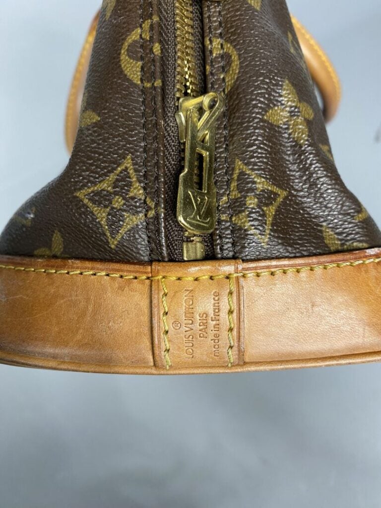 LOUIS VUITTON - Année 1994. - Sac « Alma » en toile monogram et cuir naturel, d…