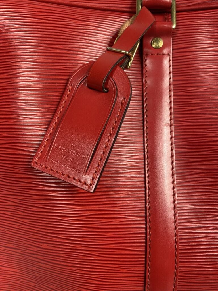 Louis VUITTON - Année 1997 - Porte-documents en cuir épi rouge, double poignée…