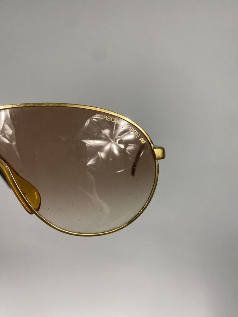PORSCHE Design - Paire de lunettes de soleil, monture en métal doré