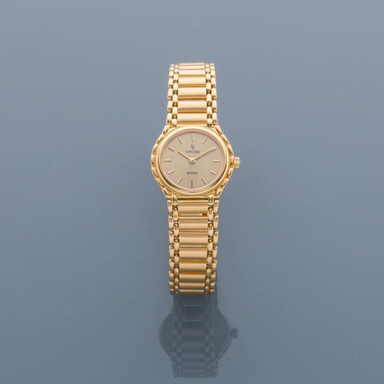 CONCORD - BRACELET MONTRE ronde de dame en or jaune (750‰). Cadran doré, index…
