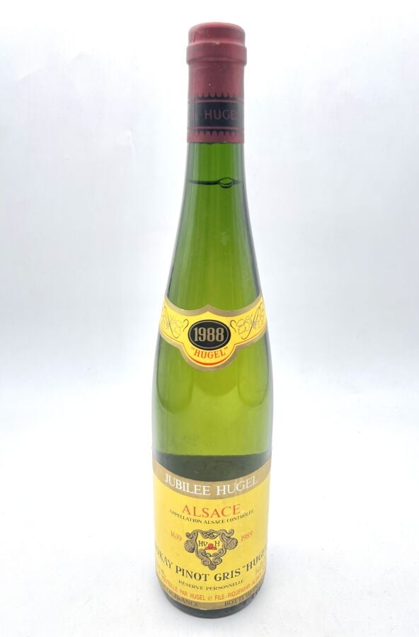 Une bouteille d'ALSACE - TOKAY PINOT GRIS - HUGEL. 1988. Étiquette légèrement t…