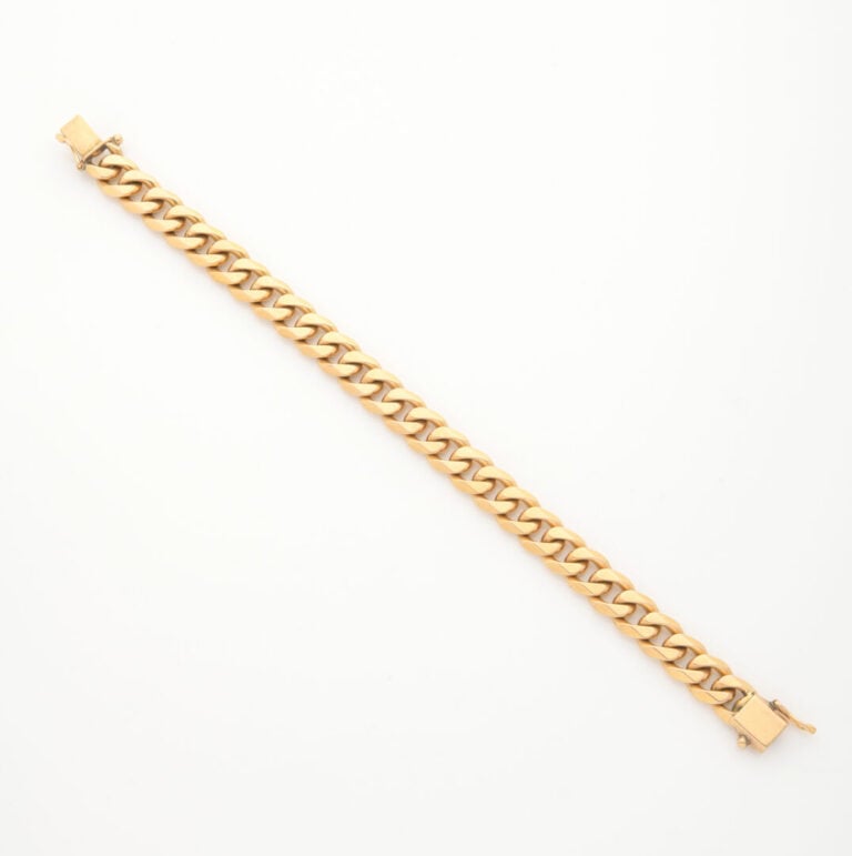 Bracelet en or jaune (750) à maille gourmette, fermoir cliquet et double huit d…