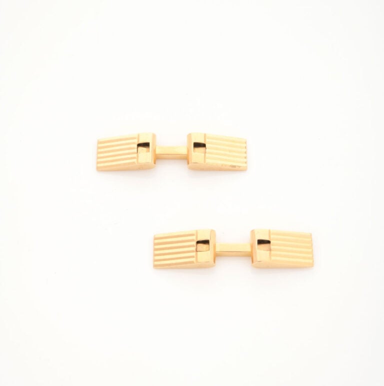 Paire de boutons de manchette en or jaune (750) à décor rainuré - Poids total :…