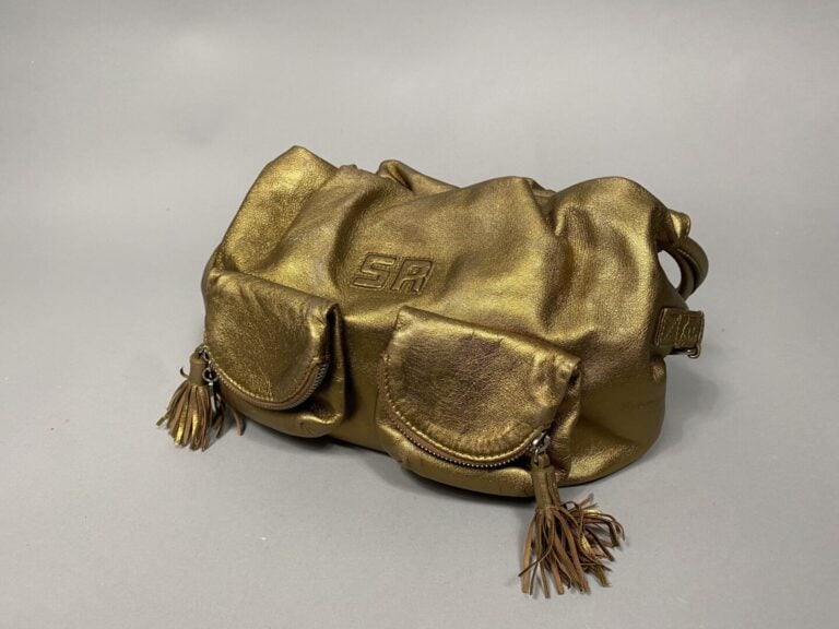 Sonia RYKIEL - Sac souple en cuir mordoré porté épaule, double anse. Deux poche…