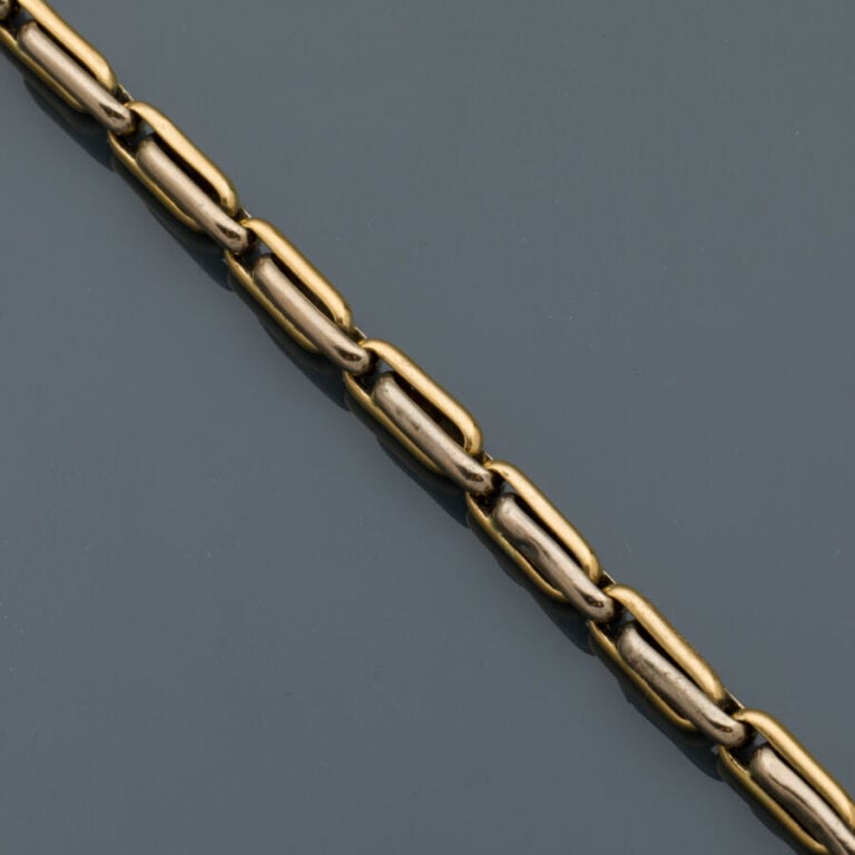 BRACELET en or jaune et or gris (750‰). Chocs. - Long.: 20 cm. Larg.: 0,5 cm. P…