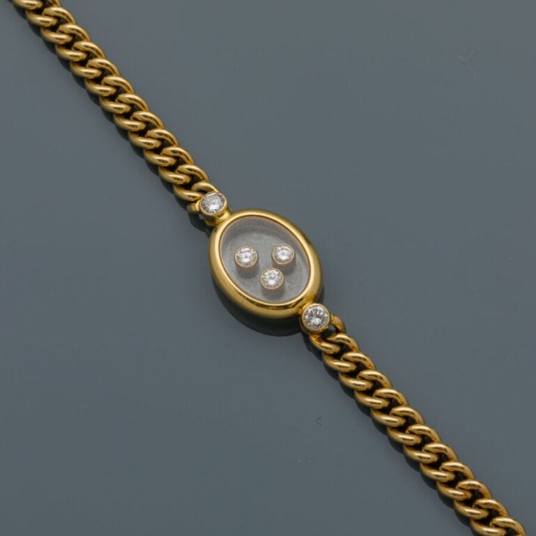 CHOPARD - BRACELET gourmette en or jaune (750‰) centré d'un motif ovale serti d…