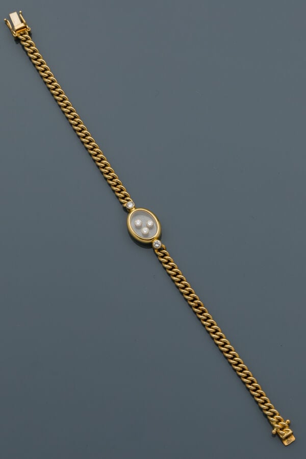 CHOPARD - BRACELET gourmette en or jaune (750‰) centré d'un motif ovale serti d…