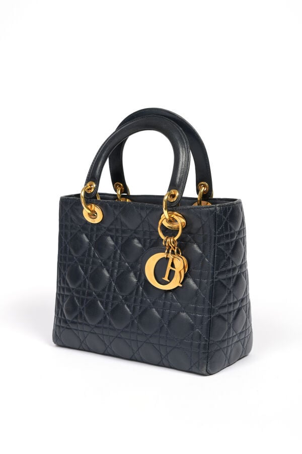 Christian DIOR - Sac « Lady » en cuir cannage marine, attributs dorés, double p…