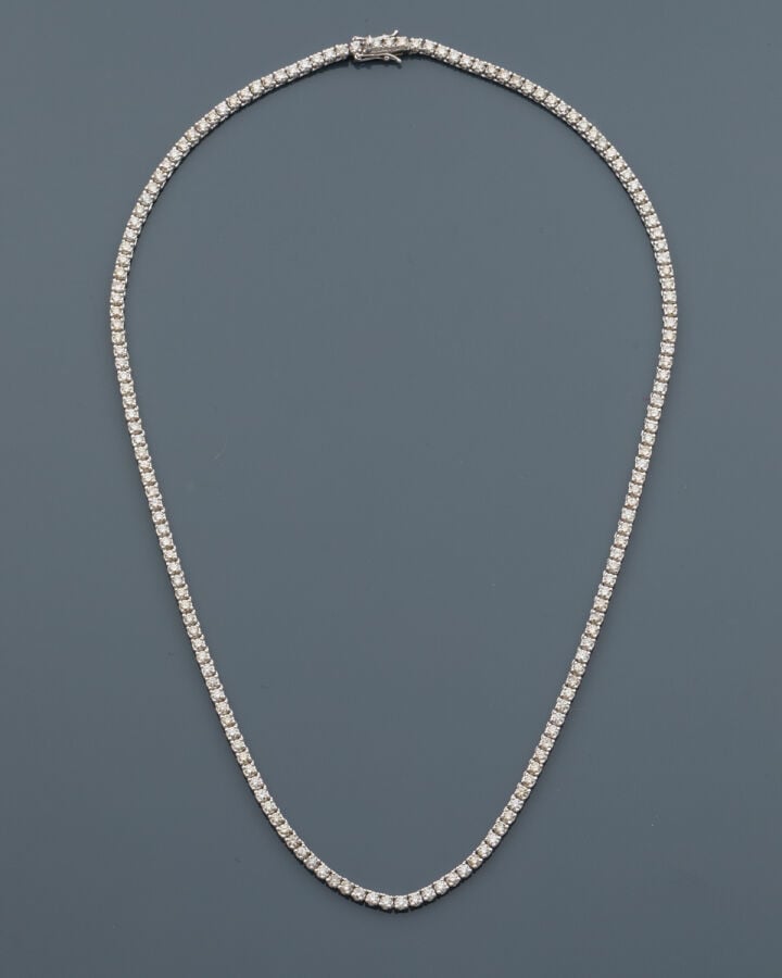 COLLIER "rivière" en or gris (750‰) serti d'un alignement de diamants taille br…