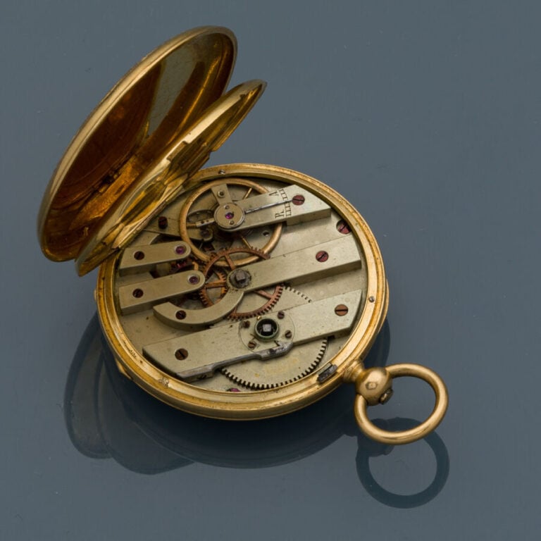 LOT en or jaune et rose (750‰) guilloché et ciselé, comprenant une MONTRE de PO…