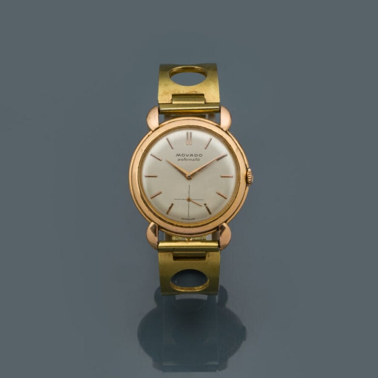 MOVADO - BRACELET MONTRE ronde en or jaune (750‰), attaches stylisées. Cadran c…